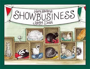 Cover of a book showing lots of show cats in boxes, and a dog peeking around the corner