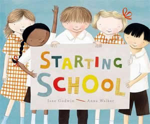 Cover of a book showing five school children holding a sign with the title on it.